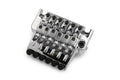 Chrome six-string guitar bridge with adjustable saddles and black screw knobs on white background
