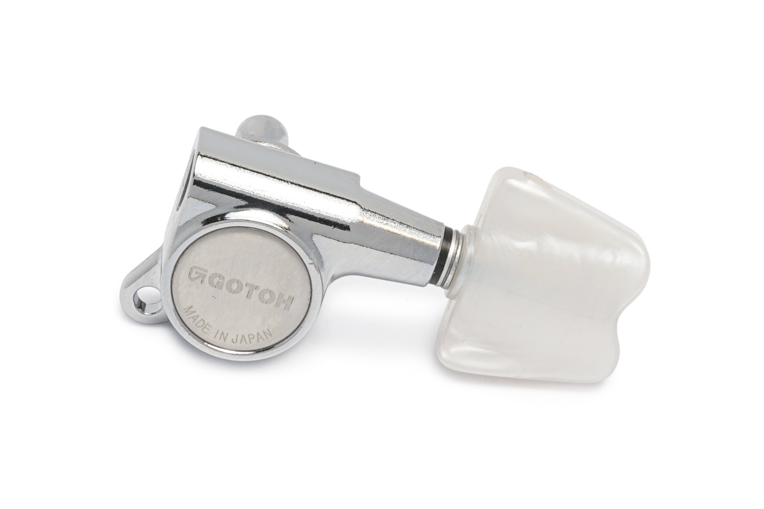 Chrome guitar tuning machine head with a white plastic tuning peg labeled Gotoh Made in Japan.