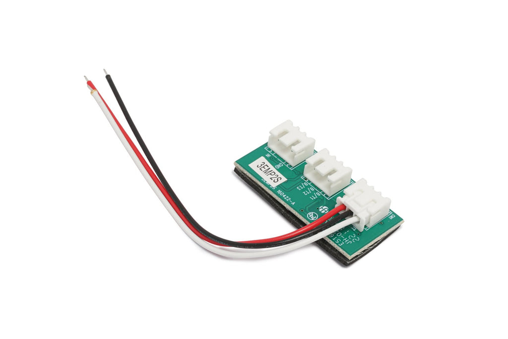 Green circuit board module with three white wire connectors and attached red, white, and black wires.