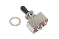 Metal toggle switch with black plastic lever and three solder lug connectors, shown with a metal washer on a white background.