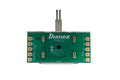 Green printed circuit board with lever switch and labeled solder terminals for wiring connections.
