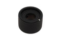 A black textured metal control knob with a small white marker on the side.