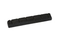 Small black guitar nut with six string slots, shown on white background.