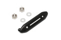 Black plastic switch plate bezel with two metal nuts and two white washers on white background.
