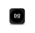 Square black device with rounded corners featuring the Hosa Technology logo on the front.