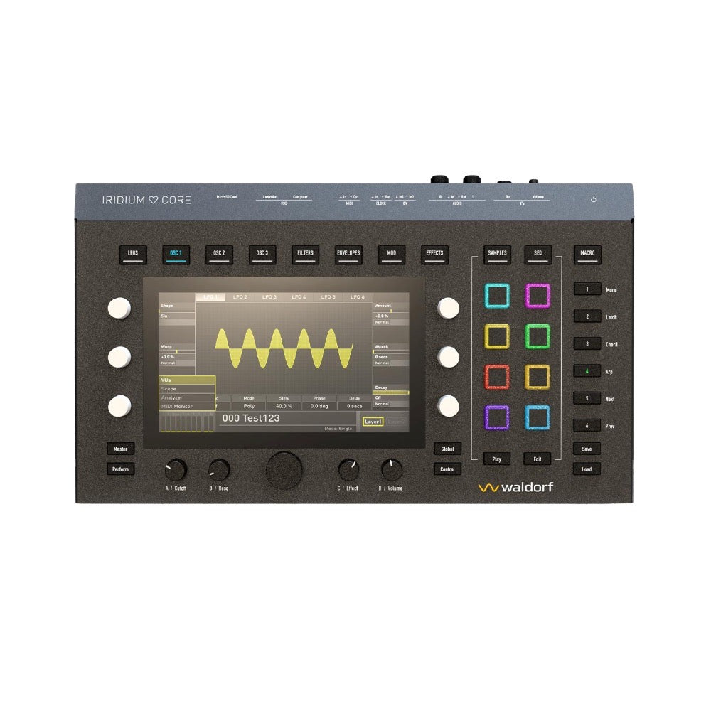 Top view of a Waldorf synthesizer with screen, knobs, color pads, and labeled buttons.