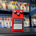 Red Maxon CP9Pro+ compressor/limiter guitar pedal with three control knobs and a footswitch is shown frontally.