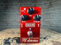 Red guitar effects pedal with three knobs, a footswitch, and MXR branding