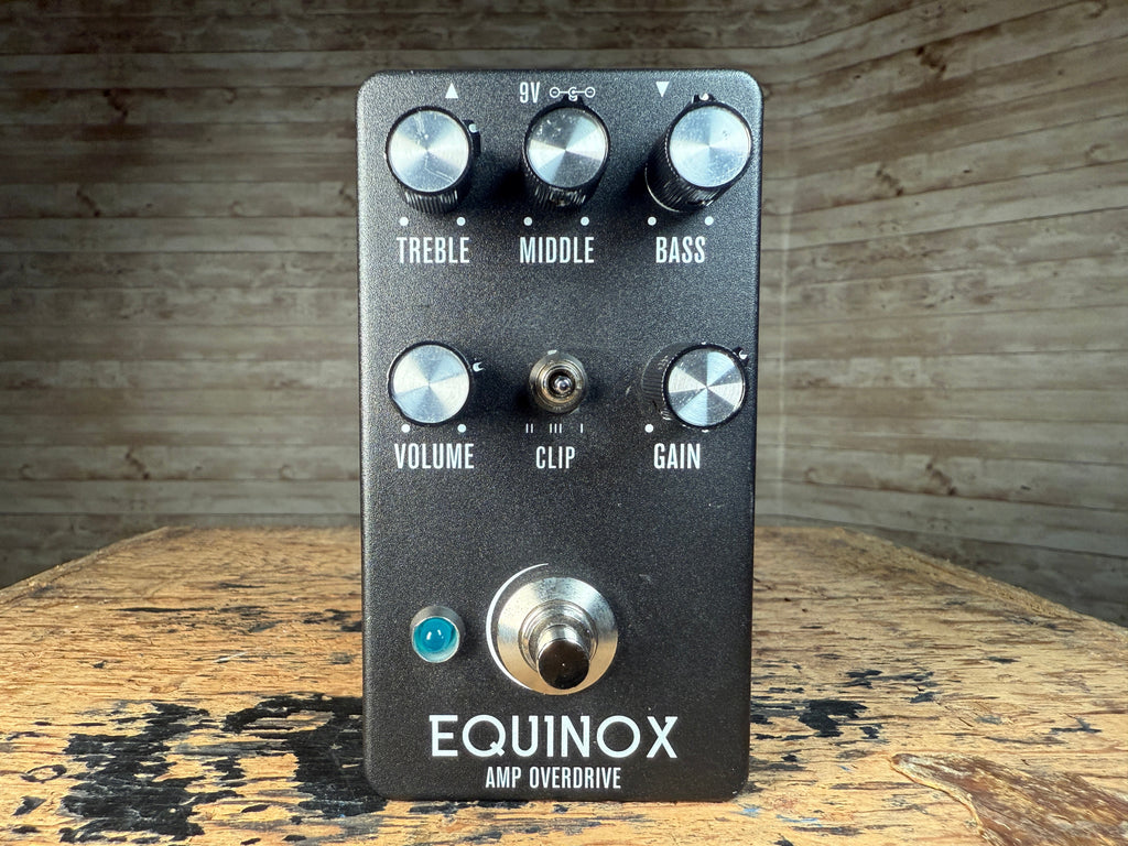 Black Equinox Amp Overdrive pedal with six knobs, a toggle switch, a footswitch, and a blue indicator light.