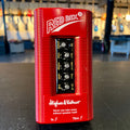 Red Hughes & Kettner pedal with five control knobs and input/thru jacks on the front, on a black surface.