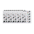 White audio mixer with five input channels, multiple knobs, toggles, mute buttons, and LED level meters on top panel.