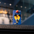 Blue guitar effects pedal with yellow lightbulb graphic, three knobs, a toggle switch, and a footswitch