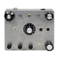Metallic device panel with multiple black and silver rotary knobs, toggle switches, push buttons, and two 1/4 inch jacks.