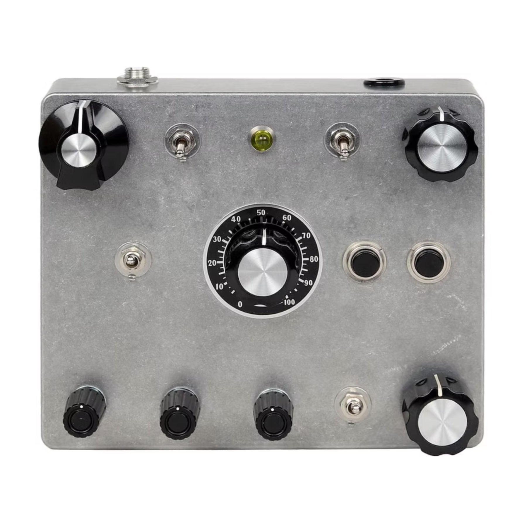 Metallic device panel with multiple black and silver rotary knobs, toggle switches, push buttons, and two 1/4 inch jacks.