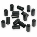 Sixteen black cylindrical knob caps scattered on a white background.