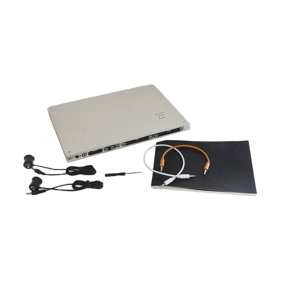 Silver metal device with multiple audio ports, earphones, patch cables, screwdriver, and a manual displayed on white background.