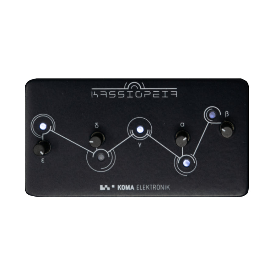 Black rectangular electronic device with knobs and blue lights labeled with Greek letters and text Kassiopeia and Koma Elektronik.