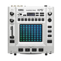 Top view of a white Korg Kaoss Pad KP V music sampler with illuminated grid pad and various knobs and buttons.