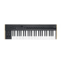 Black keyboard controller with 49 keys, multiple knobs, buttons, and pitch/modulation wheels on left side.