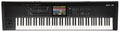 Black digital keyboard synthesizer with 88 keys, multiple controls, and a color touch screen in the center.