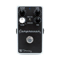 Black rectangular guitar effects pedal with four knobs, a toggle switch, and a footswitch on a white background.