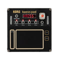 Black Korg Kaoss Pad with buttons, a rotary encoder with red LED, and a touchpad control area.