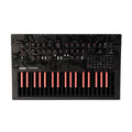 Top view of a black Korg Minilogue Bass synthesizer with red and black keys and multiple knobs and buttons.
