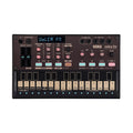 Top view of a Korg Volca FM synthesizer with control knobs, buttons, and a small keyboard.