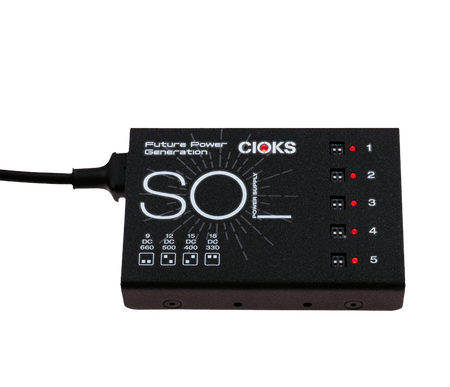 Black rectangular power supply device labeled SOL with dip switches and LED indicators numbered 1 to 5.