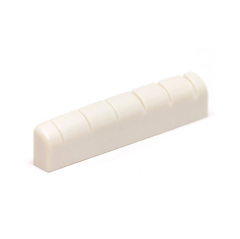 Off-white slotted guitar nut with six grooves for strings, shown on white background.