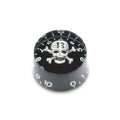 Black circular knob with white skull and crossbones design and white numbers from 0 to 10 around the edge.