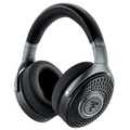 Black and gray over-ear headphones with fabric ear cushions and perforated circular metal ear cups.