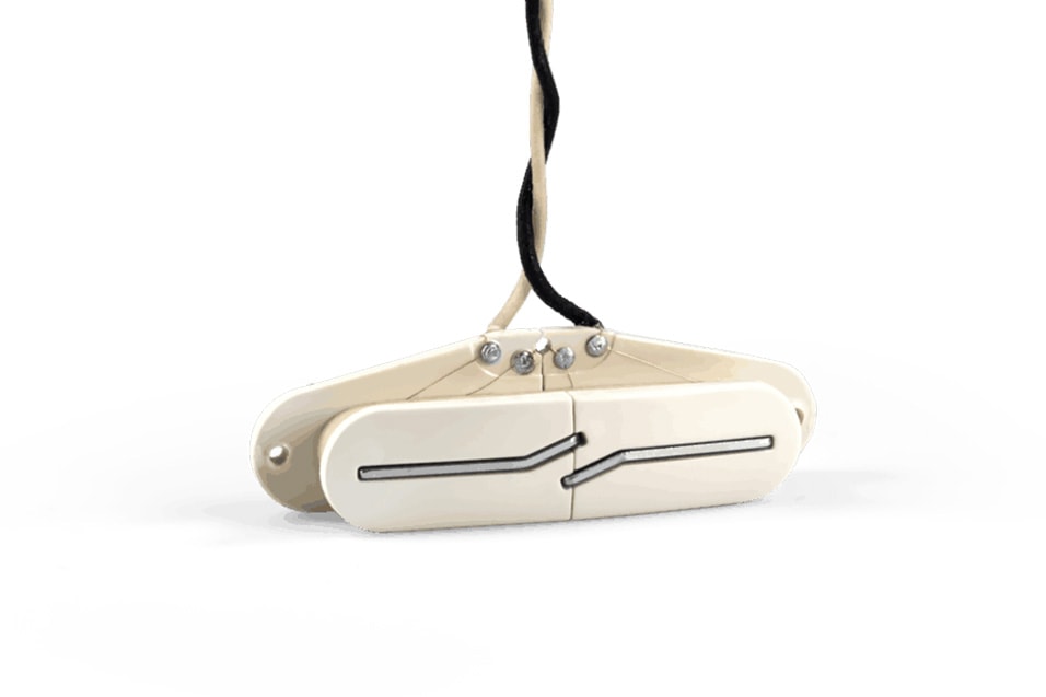 Parchement-colored guitar pickup with split blade design and two connected wires.