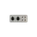 Metal device with two black knobs labeled LESS & LESS and four 1/4 inch audio jacks on the right.