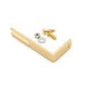 Gold-colored metal L-shaped bracket with accompanying screw, nut, and washer on white background.