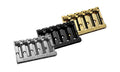 Three 5-string bass guitar bridges in silver, black, and gold with grooved saddles and adjustment screws.