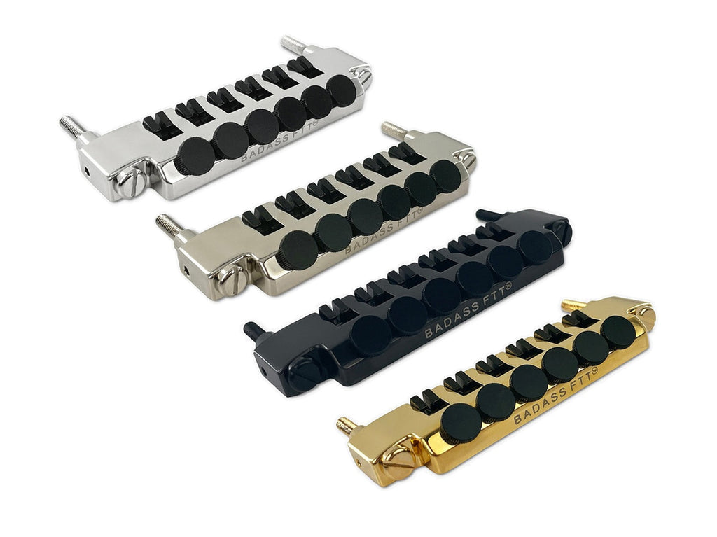 Four fine tuner tailpieces in silver, nickel, black, and gold with black tuning knobs arranged on a white background.