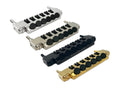 Four fine tuner tailpieces in silver, nickel, black, and gold with black tuning knobs arranged on a white background.