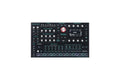 Black desktop synthesizer with multiple knobs, buttons, touchpads, and a display screen labeled ASM PolyDrum.