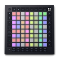 Top-down view of a black MIDI controller with colorful illuminated pads and labeled buttons.
