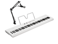 White keyboard with black and white keys, music stand, and attached microphone on adjustable black arm stand.