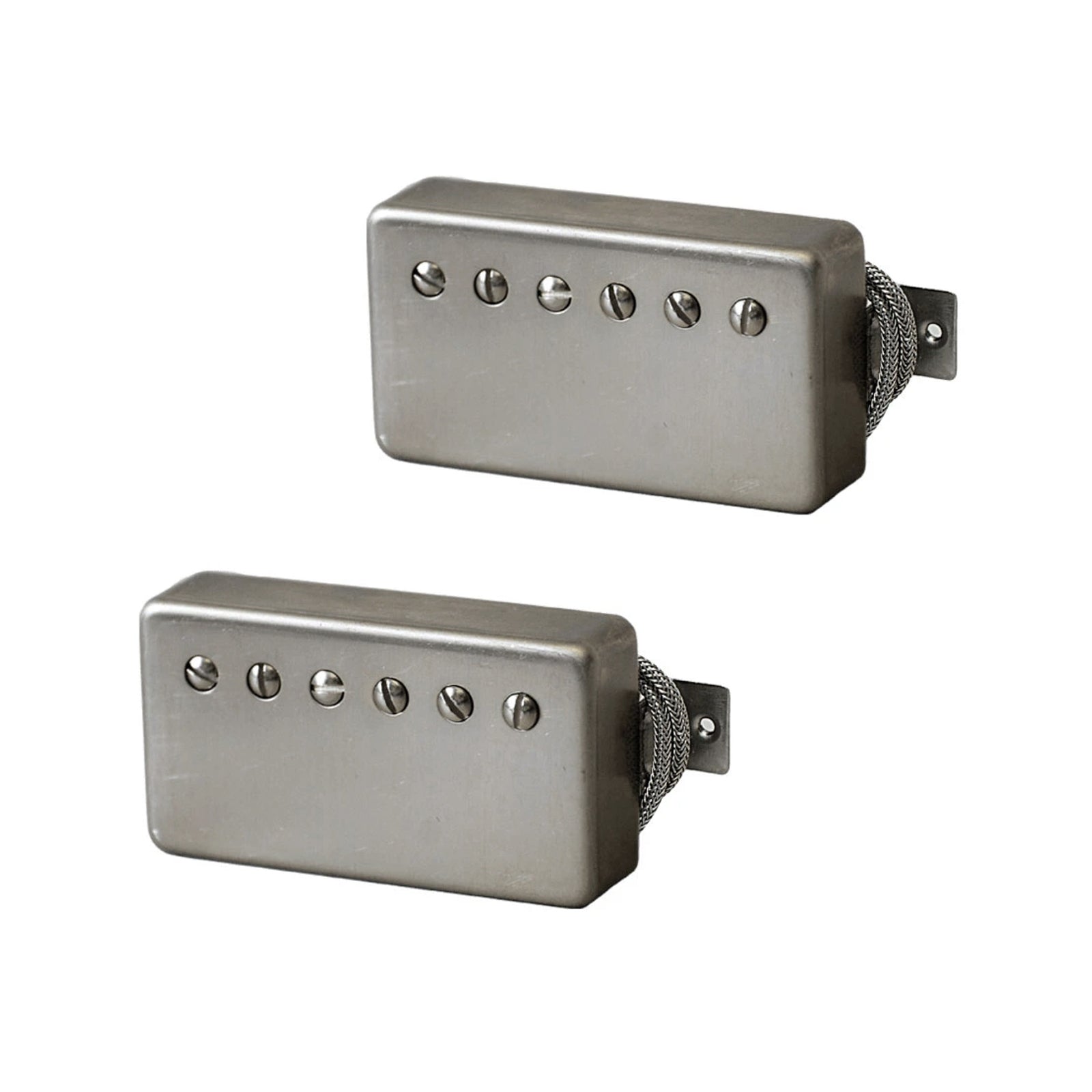 Pair of silver humbucker guitar pickups with exposed screw pole pieces and braided wire leads.