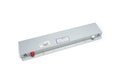 Rectangular metal spring reverb tank with red and white connectors and labels on top surface.
