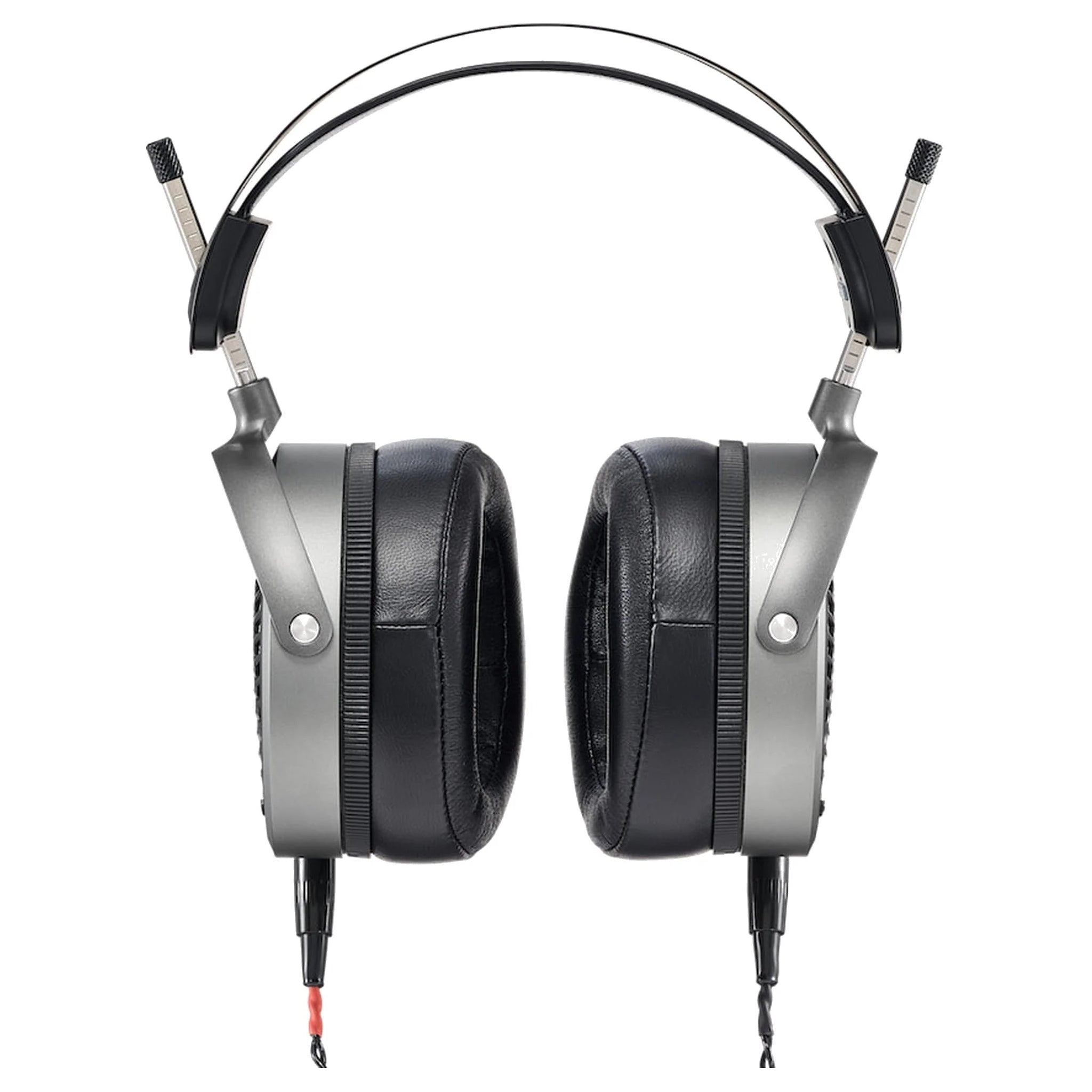 Front view of over-ear headphones with black cushioned ear pads and silver frame showing wired connectors.
