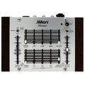 Top-down view of a Hikari Monos synthesizer with sliders, toggle switches, rotary knob, and 3.5mm jacks on a wood-sided metal panel.