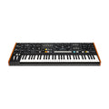 Black synthesizer keyboard with wooden sides and multiple control knobs, sliders, and buttons on top panel.