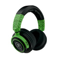 Over-ear closed-back headphones with green patterned headband and black ear cushions.