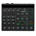 Top view of a black audio mixer with multiple channels, rotary knobs, buttons, and Bluetooth indicator light.