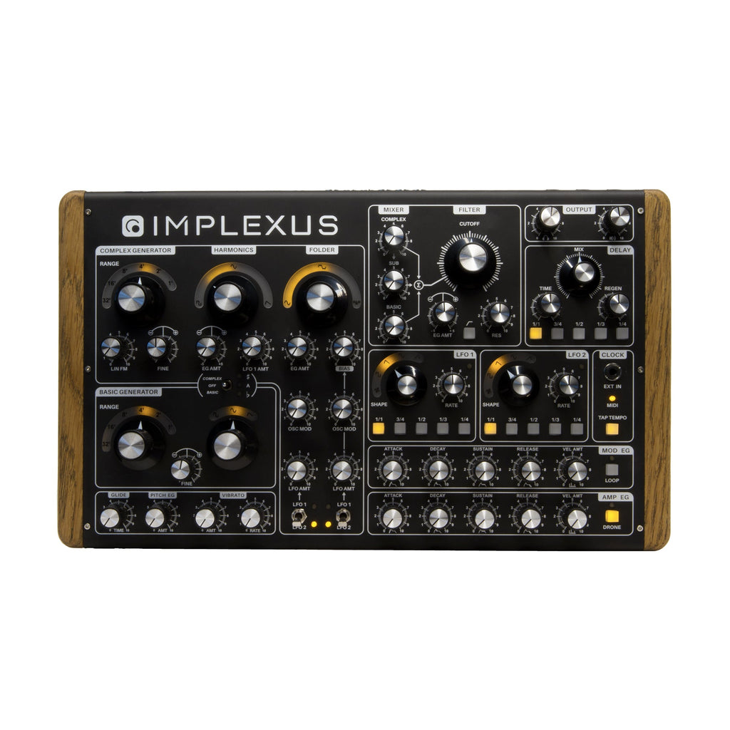 Black synthesizer with wood side panels featuring multiple labeled knobs and jacks on a flat surface.