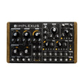 Black synthesizer with wood side panels featuring multiple labeled knobs and jacks on a flat surface.